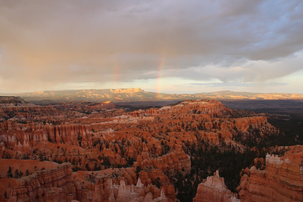 A rainbow over the red rock formations of the Bryce Canyon amphitheater.